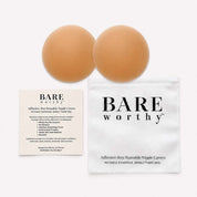 two brown balls next to a white bag