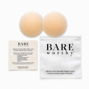 two brown balls next to a white bag
