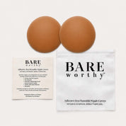 a pair of brown balls next to a white bag